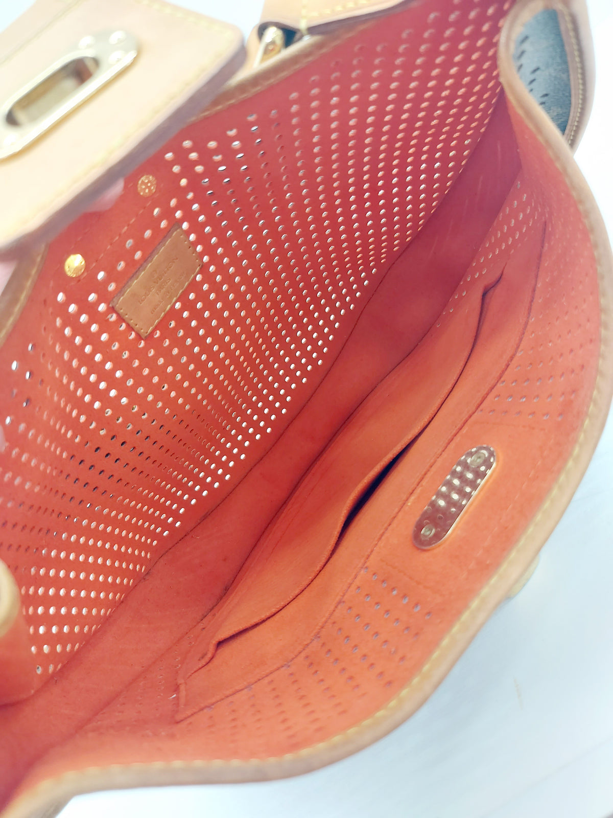 LOUIS VUITTON LIMITED EDITION ORANGE PERFORATED DEMI LUNE