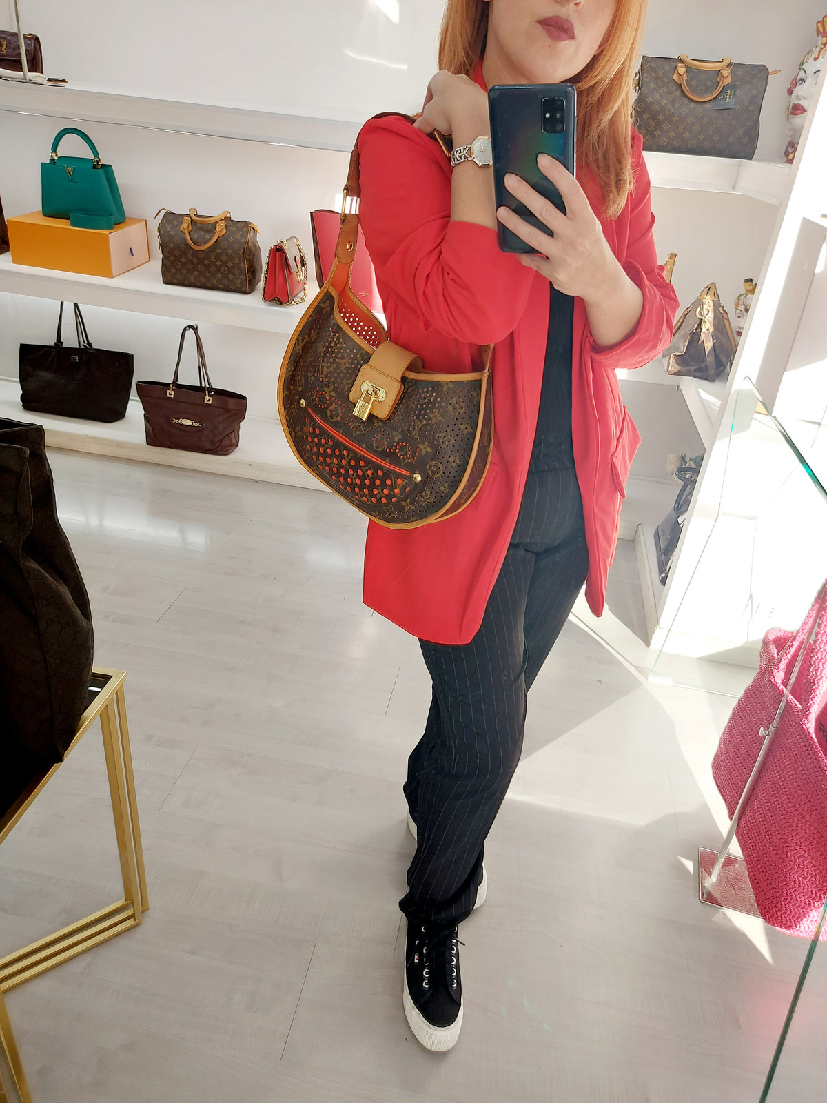 LOUIS VUITTON LIMITED EDITION ORANGE PERFORATED DEMI LUNE