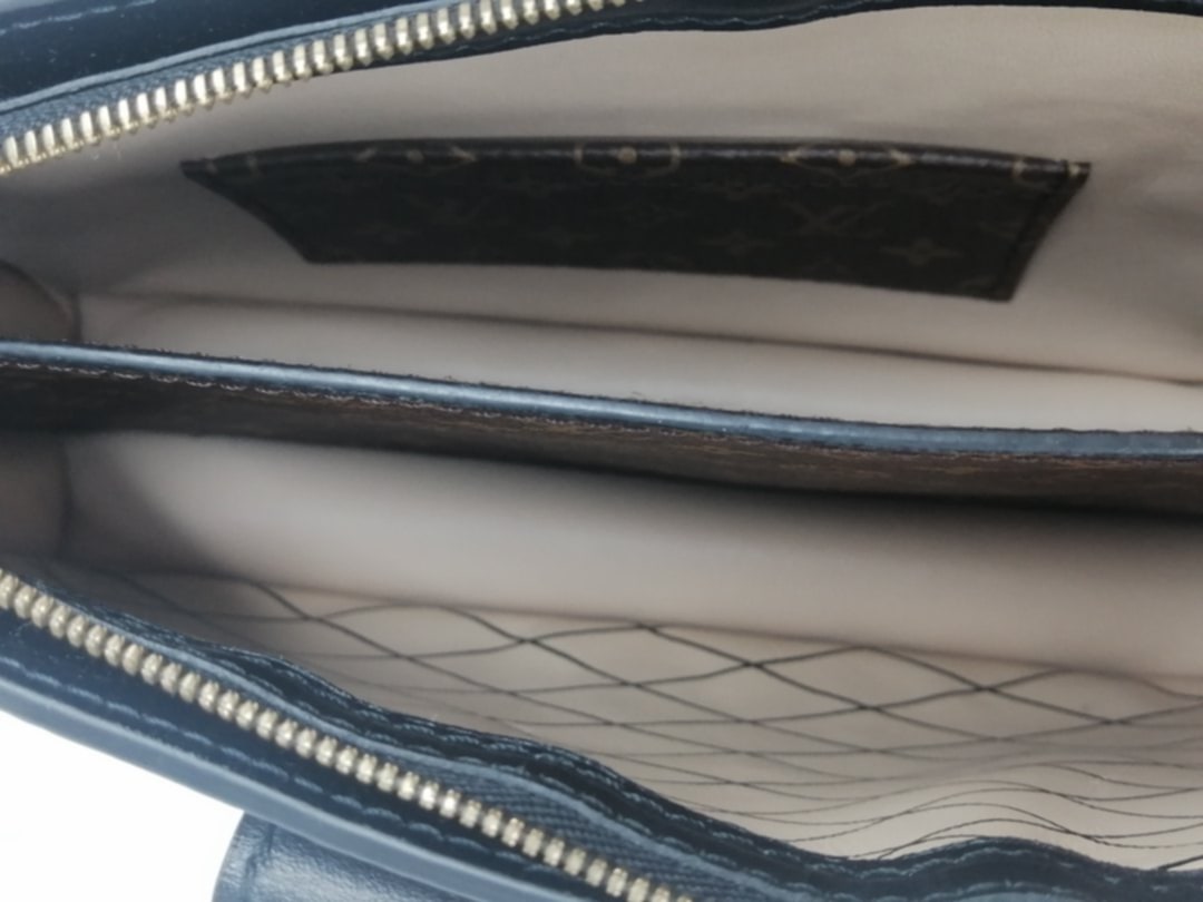 LOUIS VUITTON TRUNK CLUTCH REVERSE