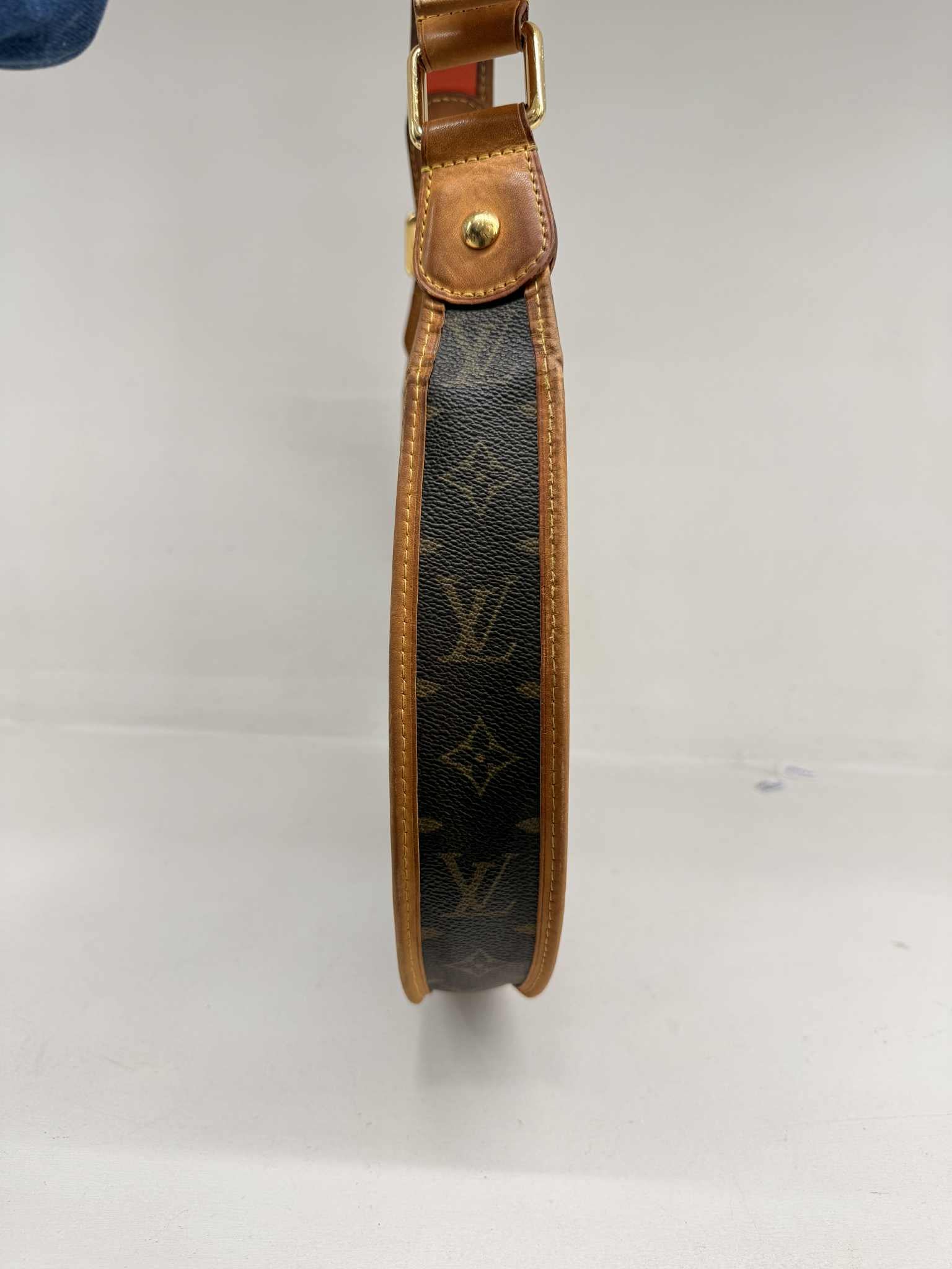 LOUIS VUITTON LIMITED EDITION ORANGE PERFORATED DEMI LUNE