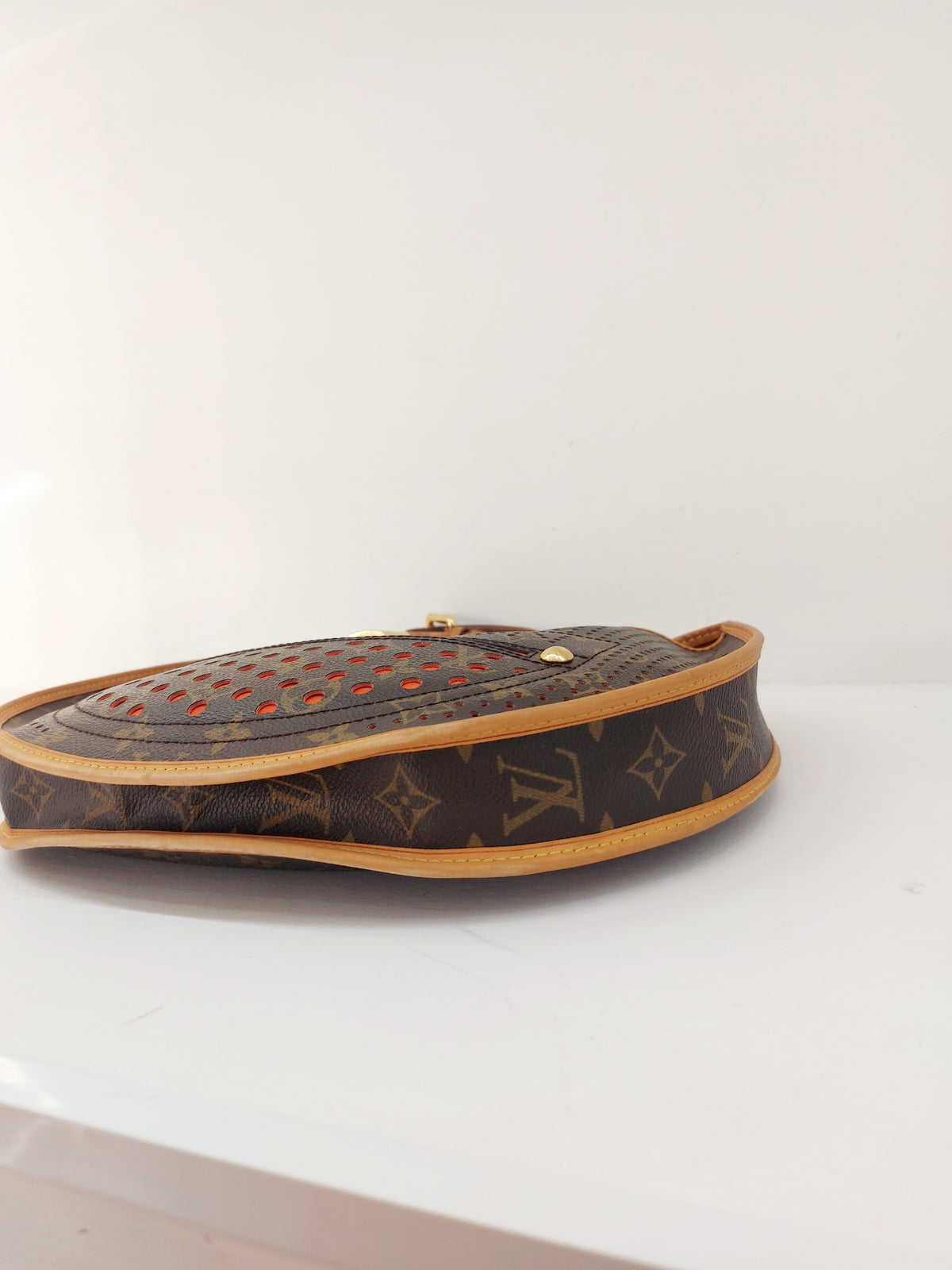 LOUIS VUITTON LIMITED EDITION ORANGE PERFORATED DEMI LUNE