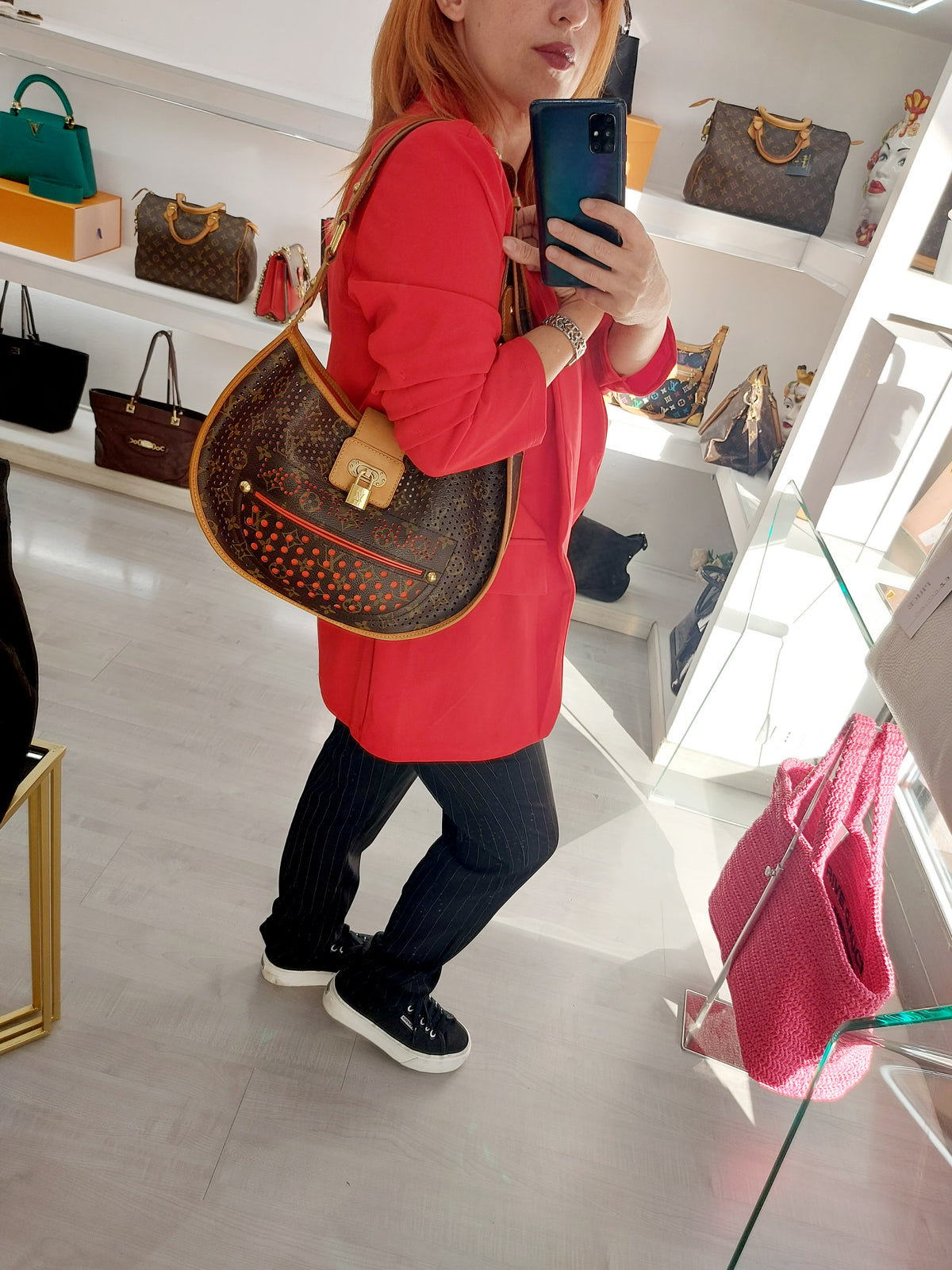 LOUIS VUITTON LIMITED EDITION ORANGE PERFORATED DEMI LUNE